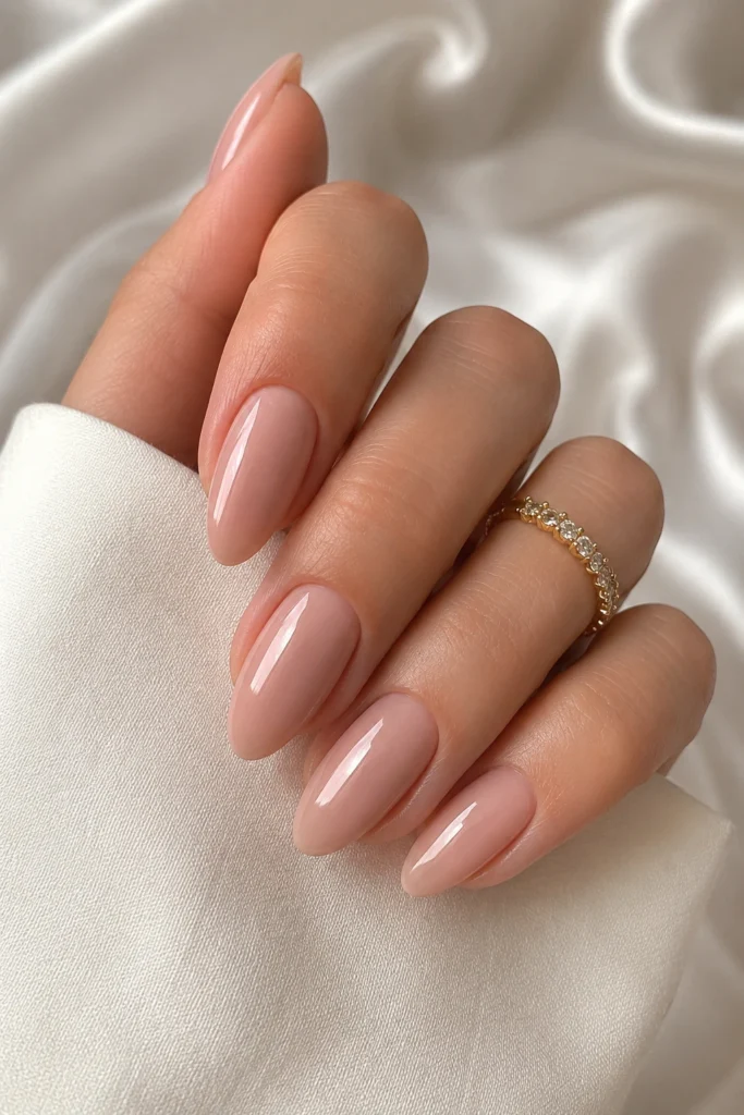 Glossy nude almond nails for moms to be