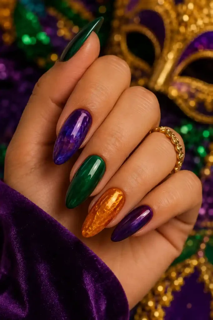 Rich jewel tone almond nails in Mardi Gras colors