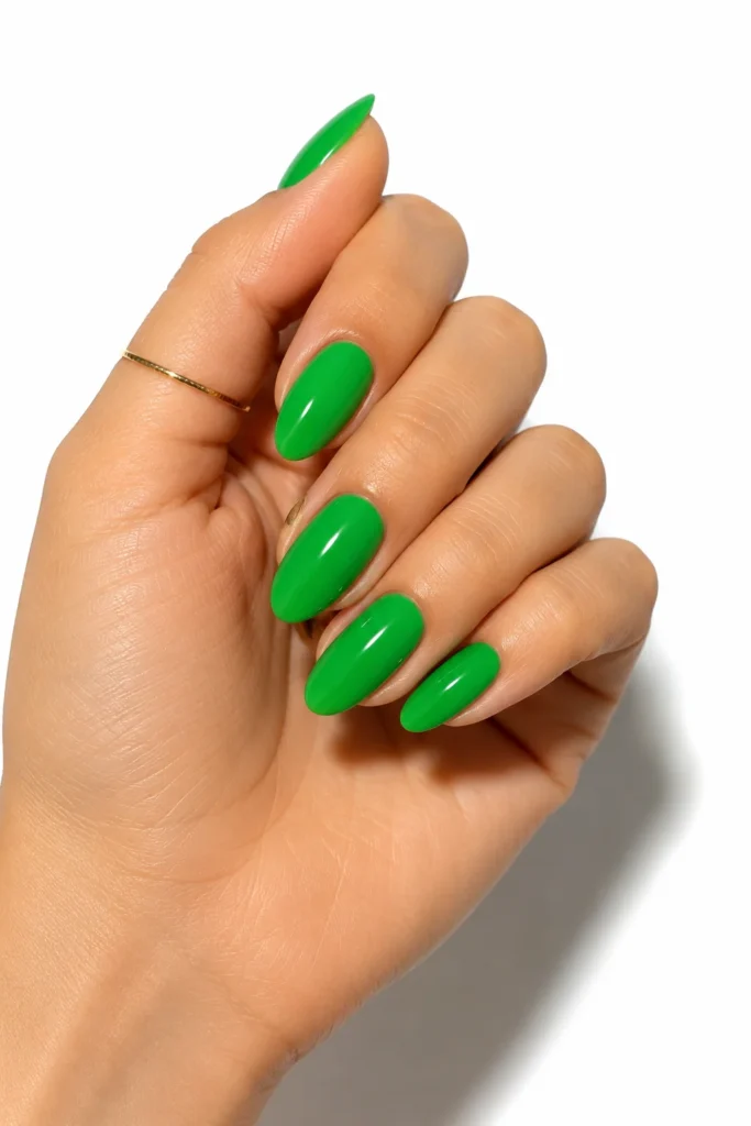 Kelly green almond-shaped nails with glossy finish
