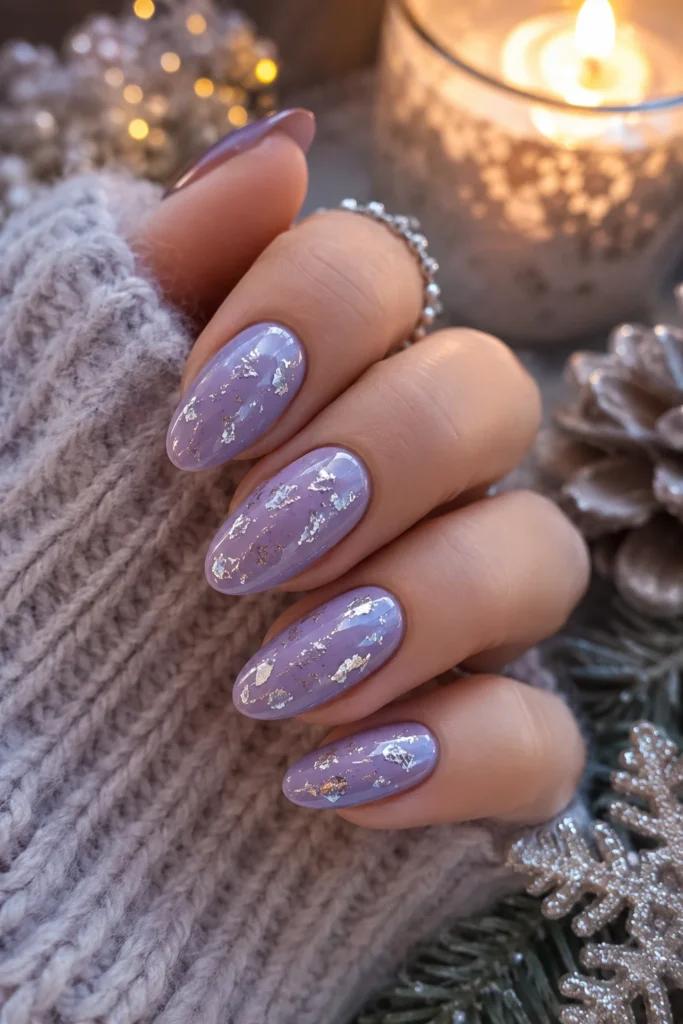 Lilac nails decorated with shimmering silver foil flakes