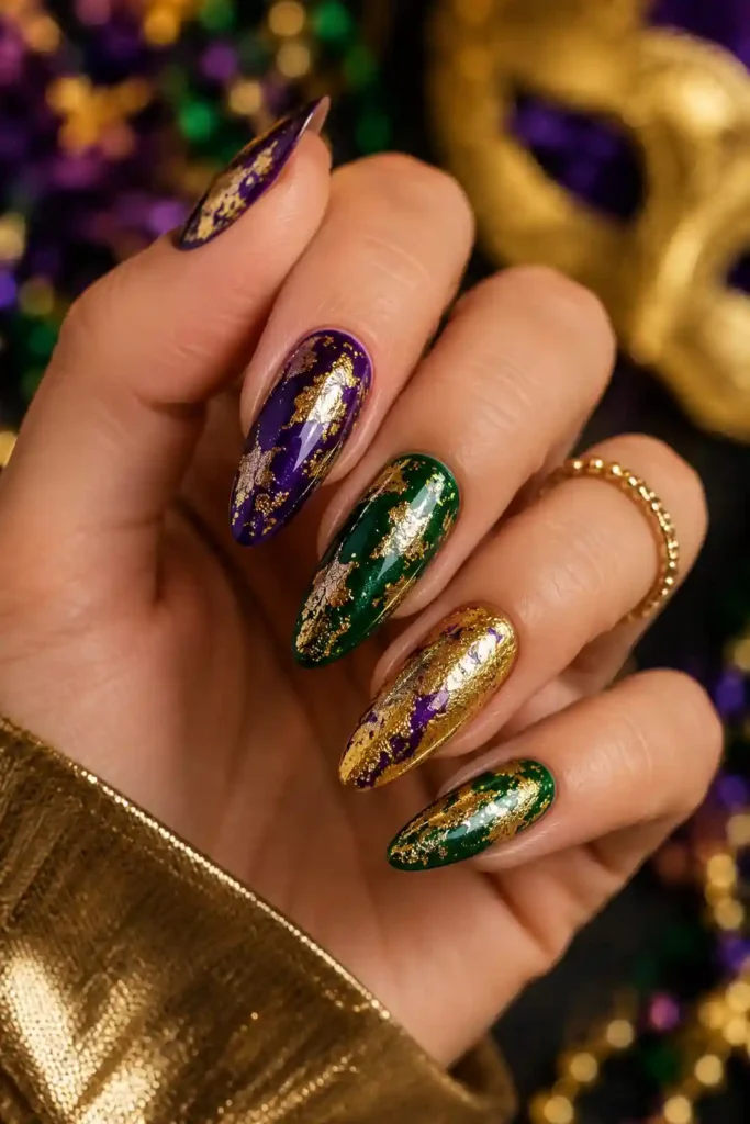 Metallic gold foil nails layered over festive Mardi Gras colors