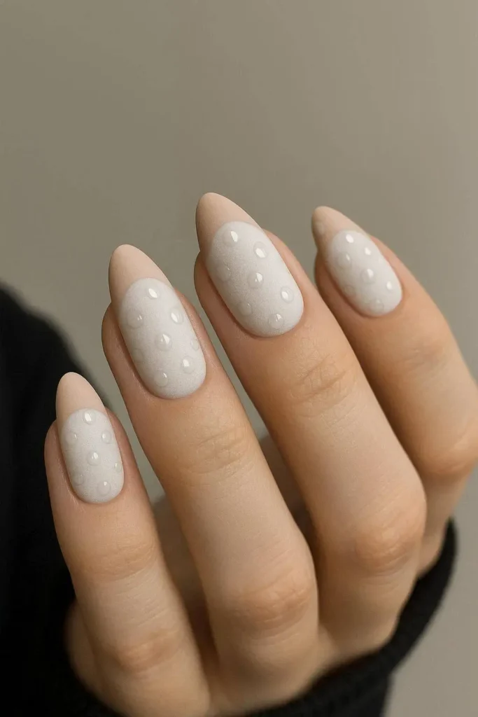 Matte French tip nails with glossy polka dots