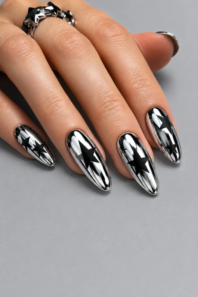 Metallic chrome nails with matte black star designs
