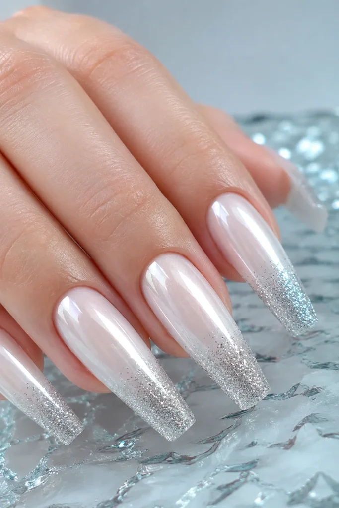 Milky chrome coffin nails with silver glitter tips