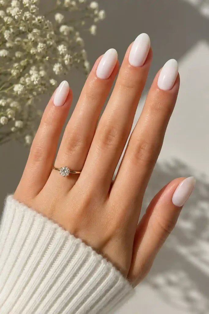 Milky white glossy spring nails with clean seasonal finish