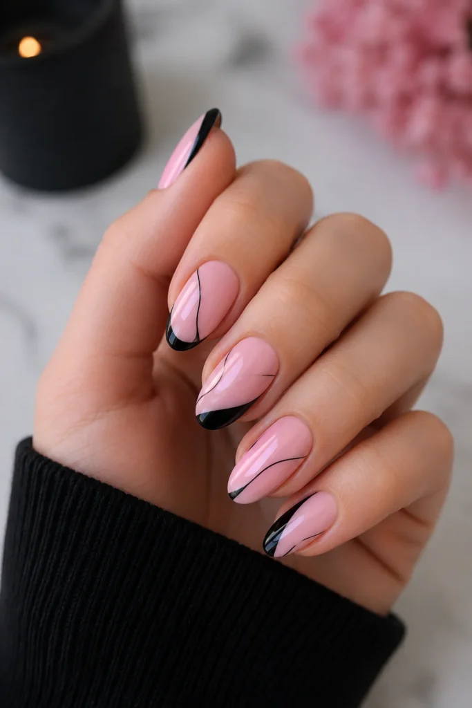 Minimalist pink nails with fine black line art