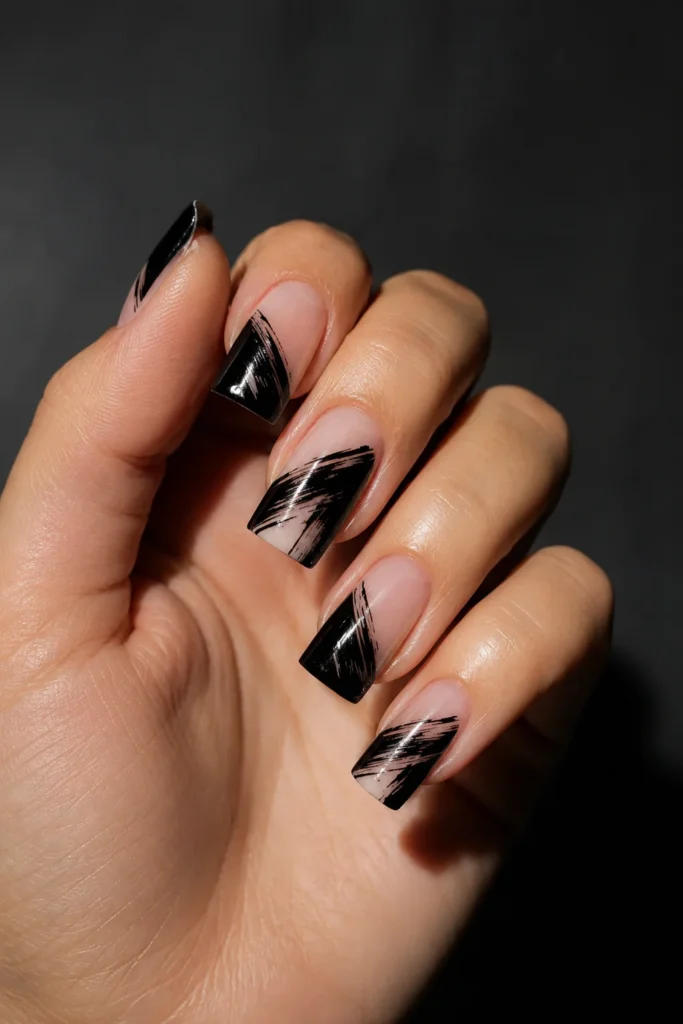 Negative space nails with bold black brush line art