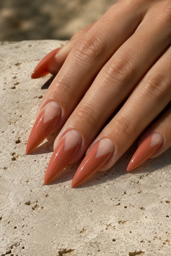 Pointy nails featuring minimalist negative space triangle nail art