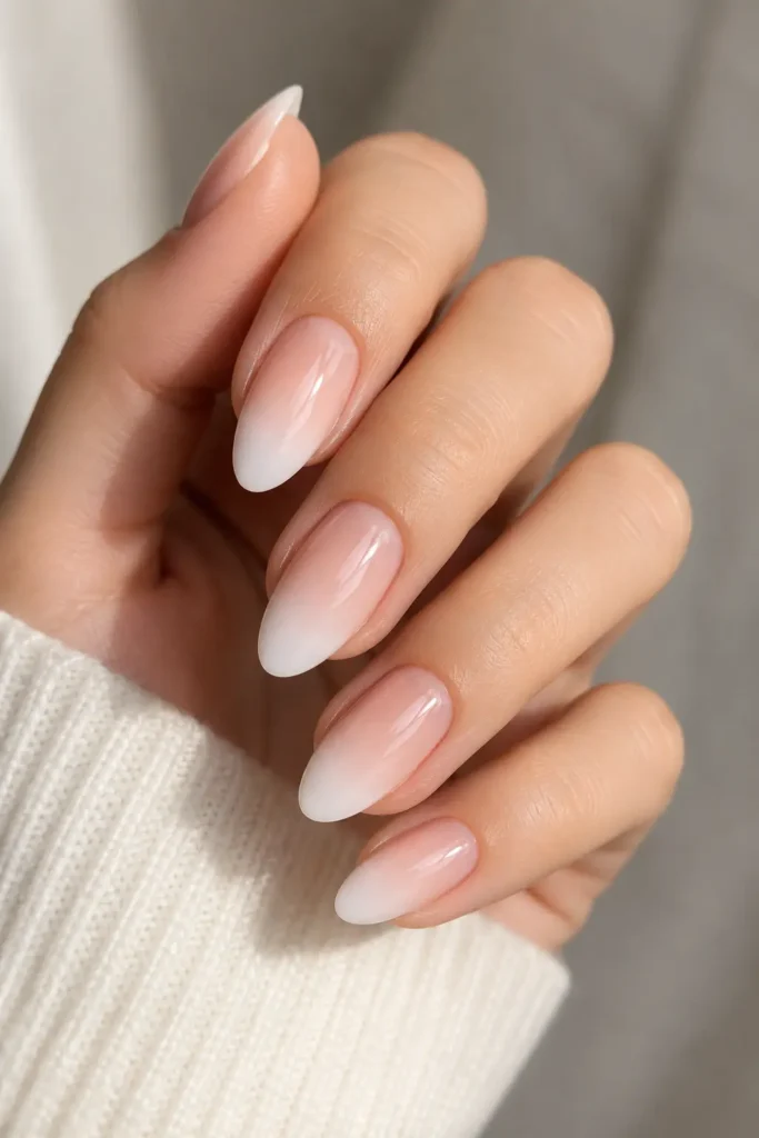 Nude pink to white ombre gradient nail design