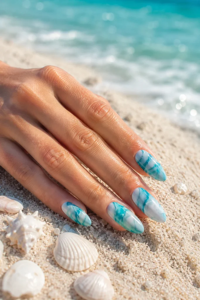 Ocean blue swirl marble nails with white base