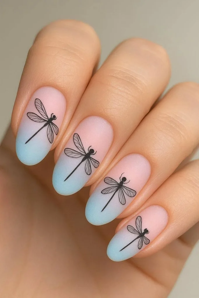Ombre nails with delicate dragonfly silhouette design