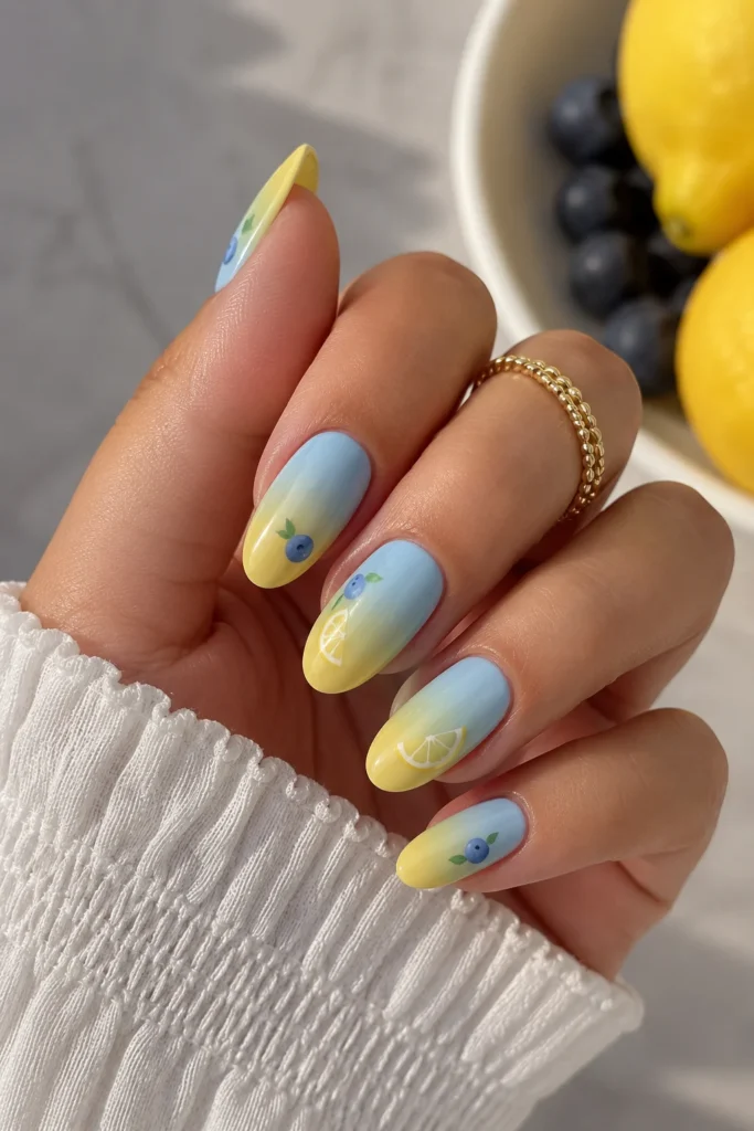 Blue to yellow ombre nails with fruit theme