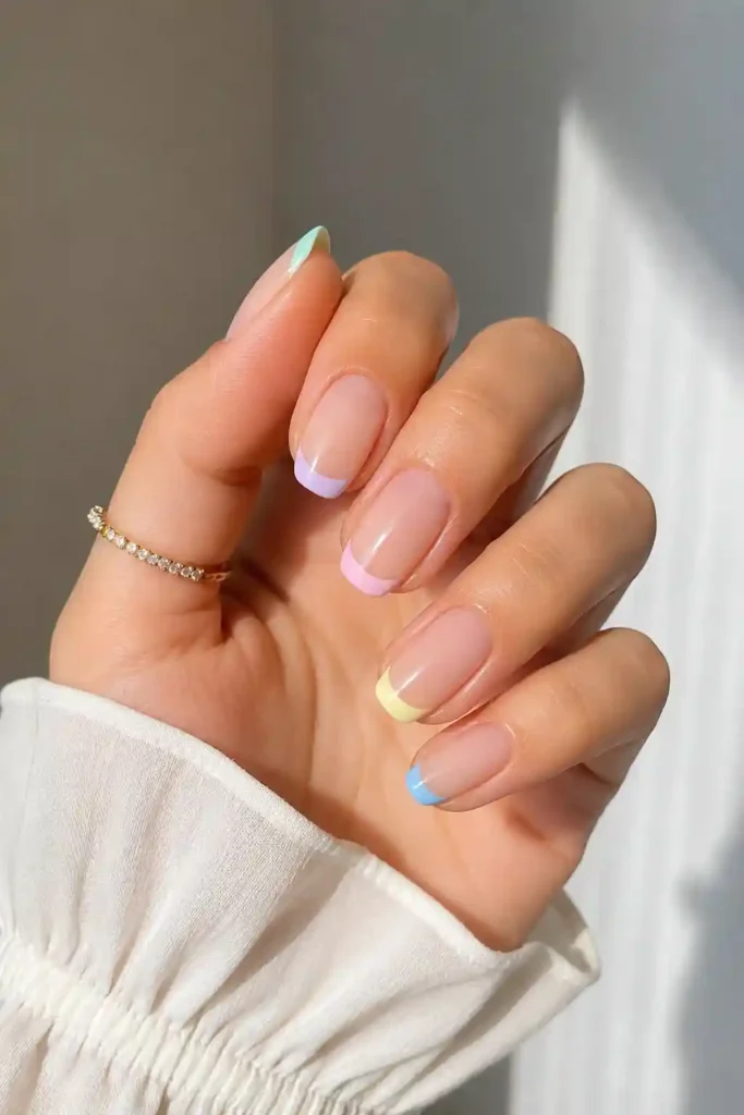 Soft pastel French tip nails updated for spring manicure