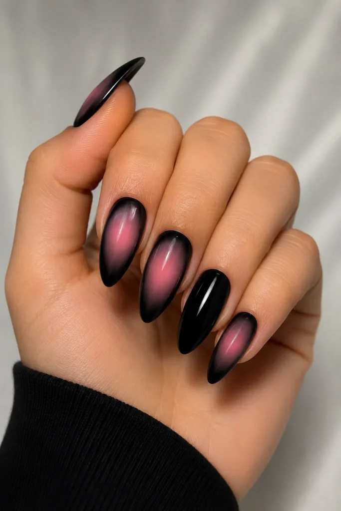 Pink aura nail art paired with sleek black nails
