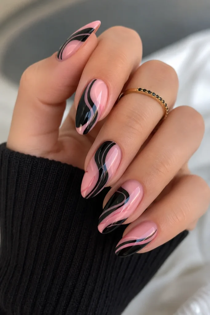 Abstract pink and black swirl nail art design