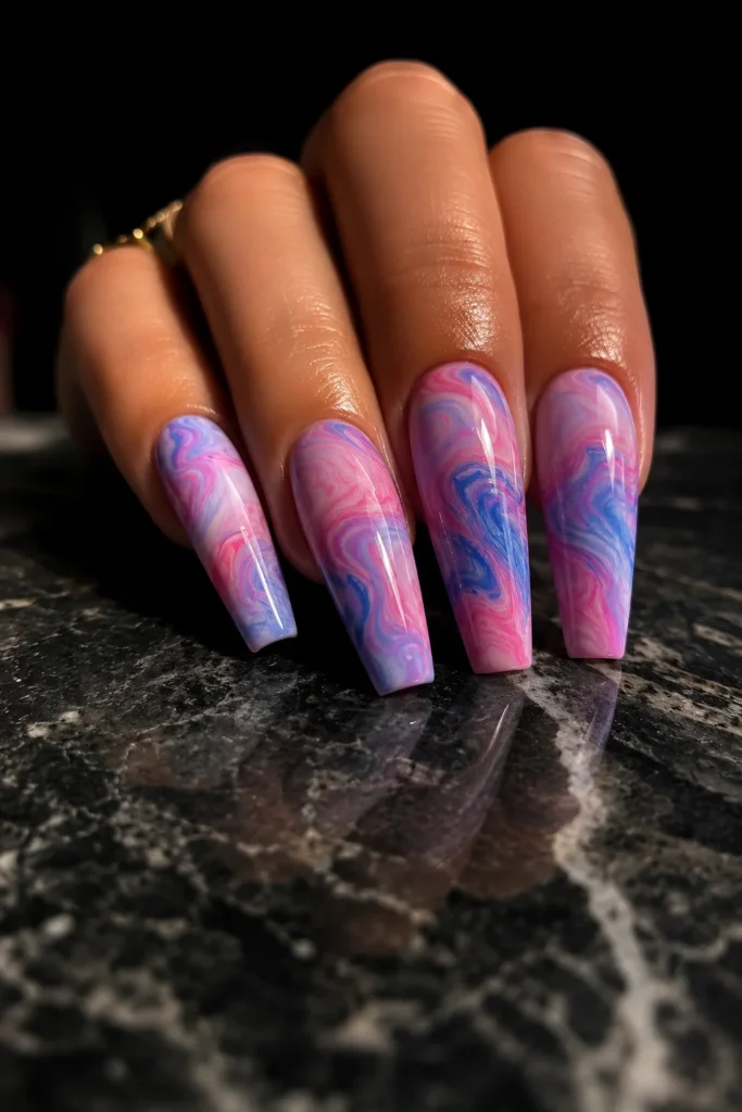 Pink and blue marble nail art with glossy finish