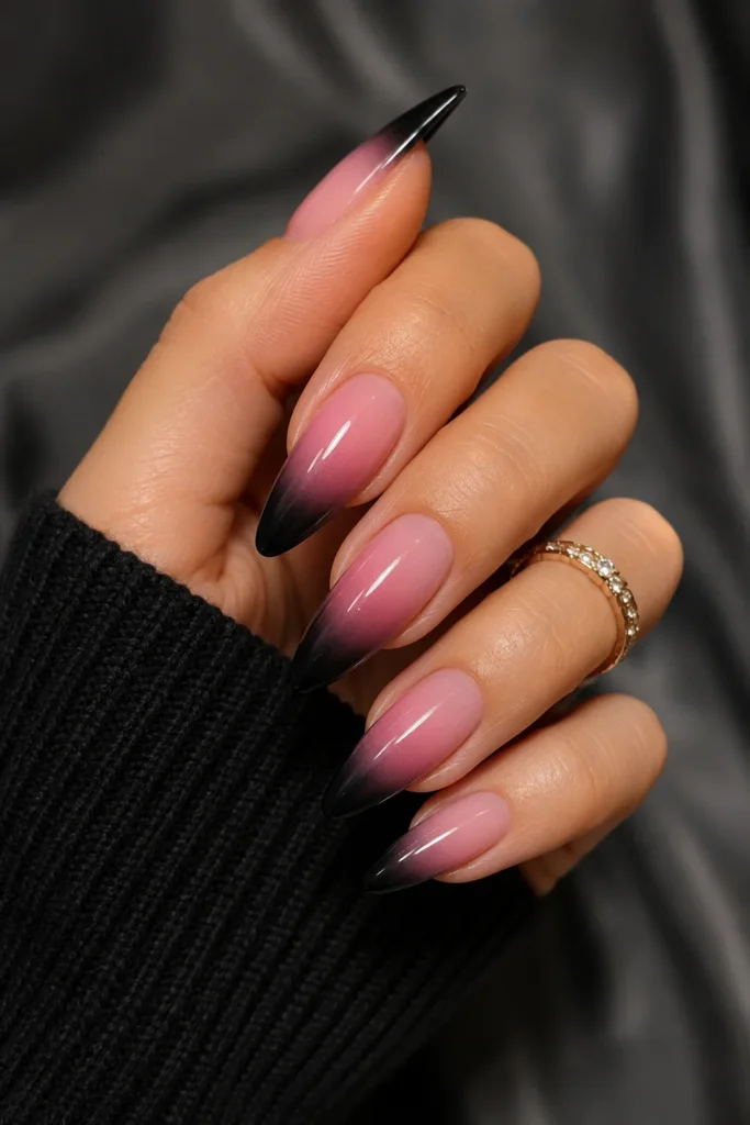 Pink ombre nails with dramatic black tips