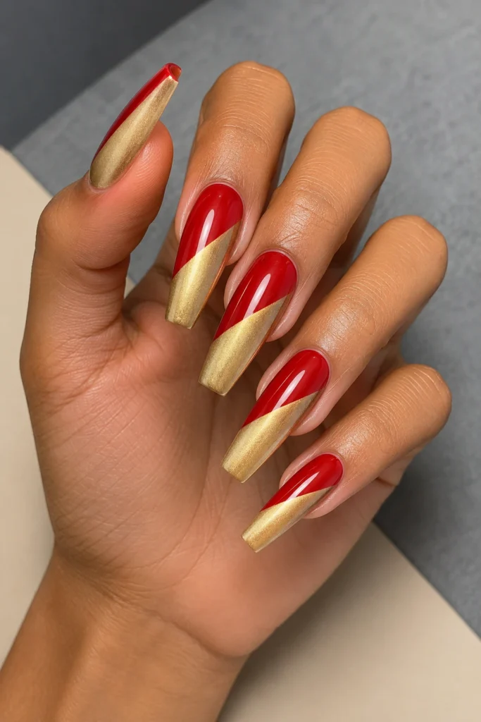 Red and gold split two-tone nail design.