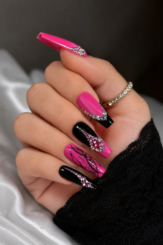 Rhinestone embellished pink and black nail design
