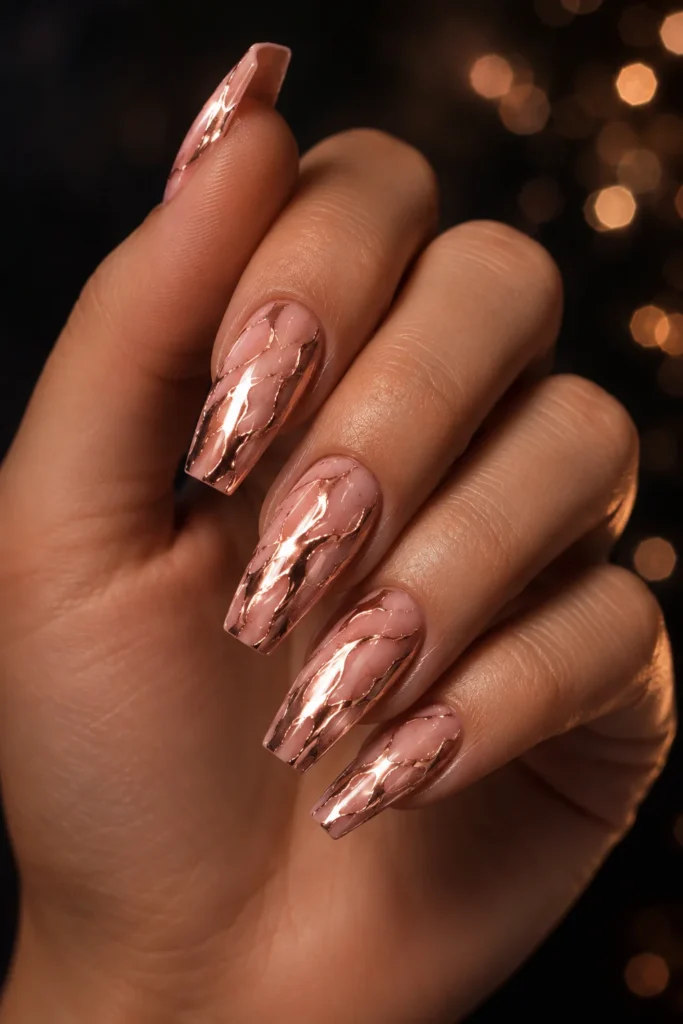 Rose gold chrome marble nails on coffin shape