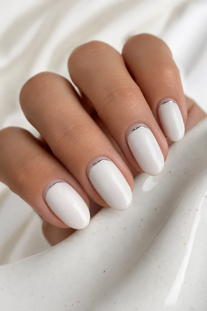 White oval nails with thin silver cuticle line