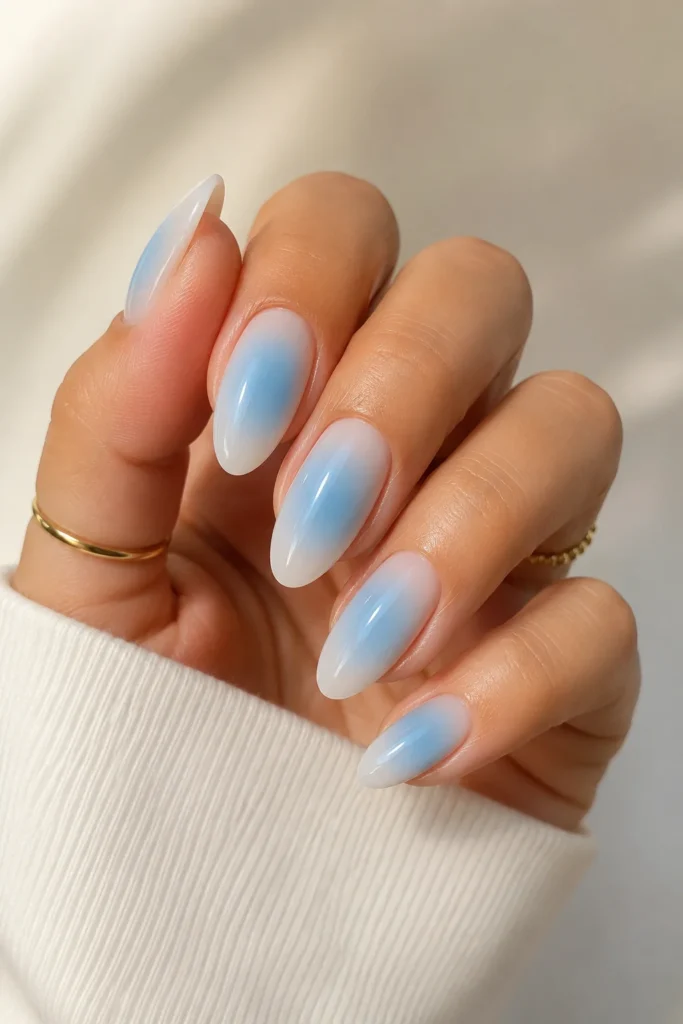soft sky blue glossy almond aura nails