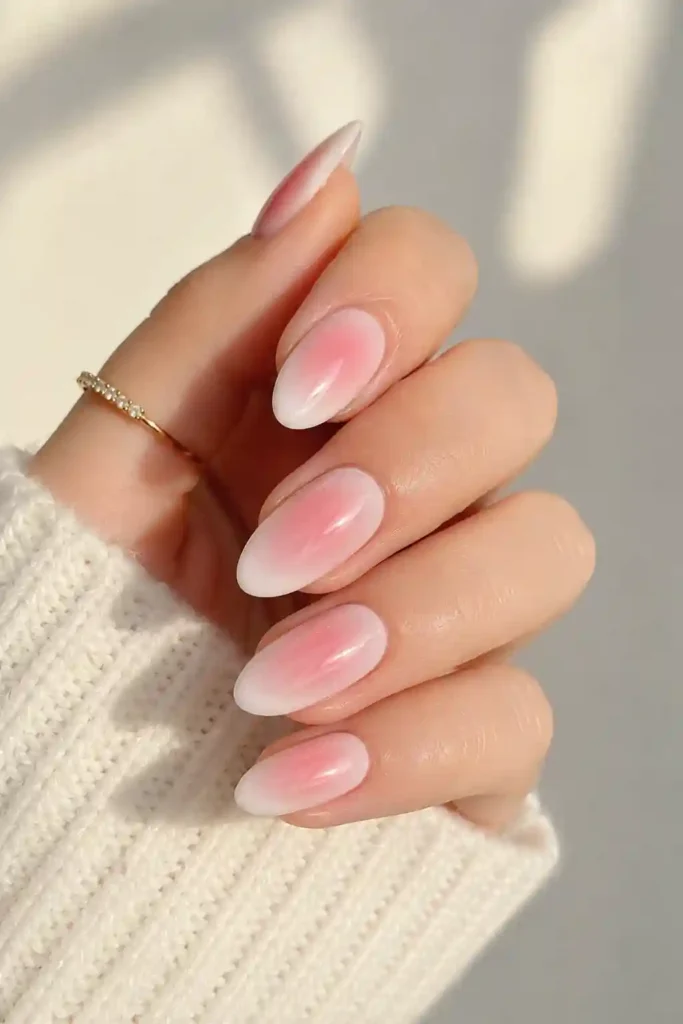 Soft pink aura nails with milky base for spring