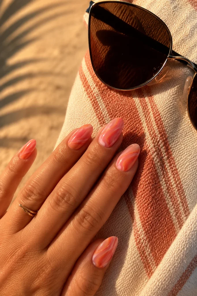 Sunset coral marble nail design