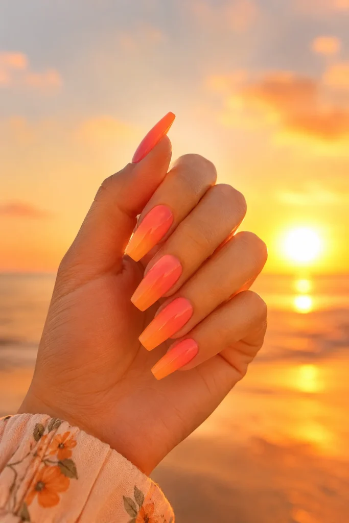 Sunset gradient ballerina nails in coral and orange shades