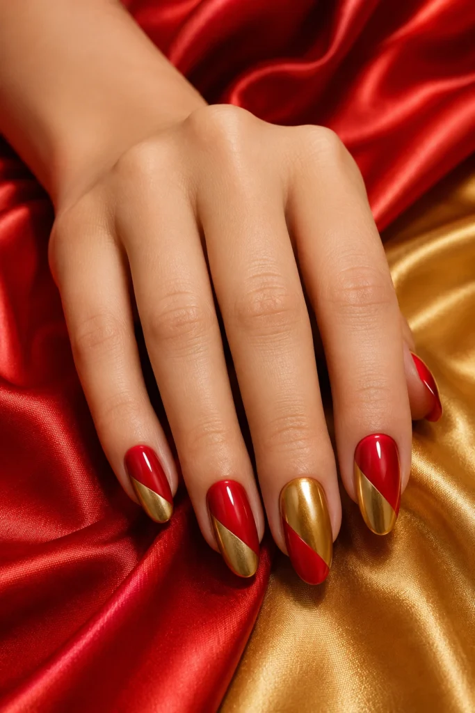 Two-tone red and gold color block nail design