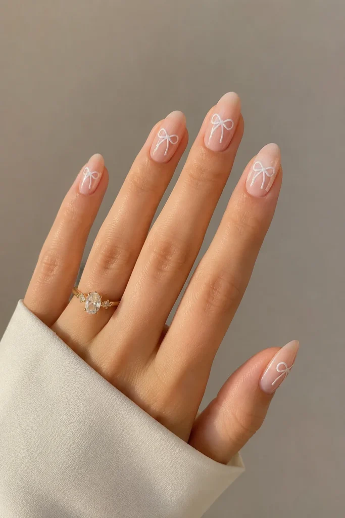 White bow accents on bridal shower nails