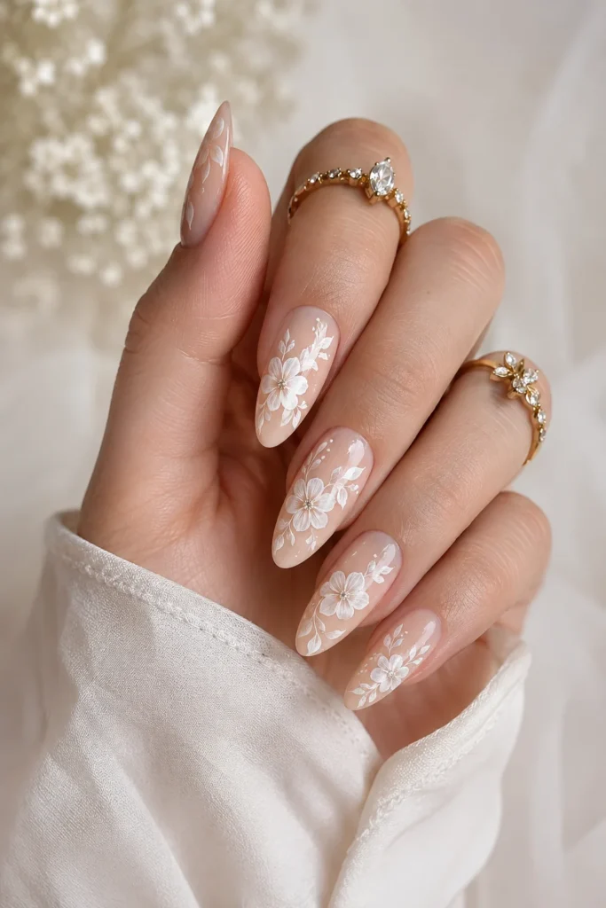 Hand painted white flowers on sheer nude nails