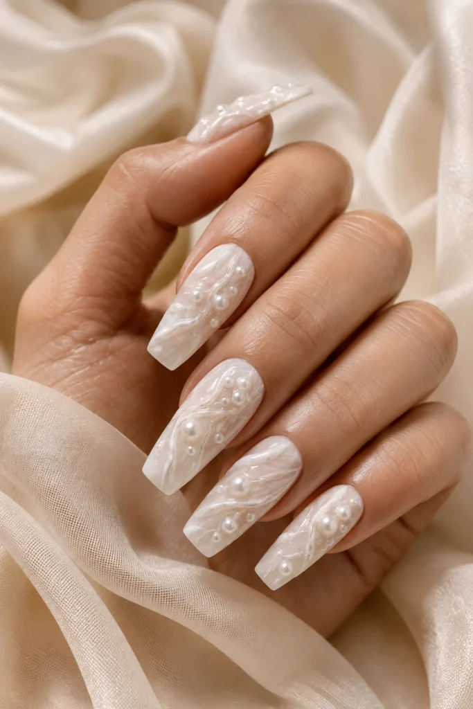3D white marble nails with textured accents