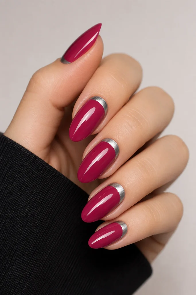 Berry pink nails with silver half-moon tips