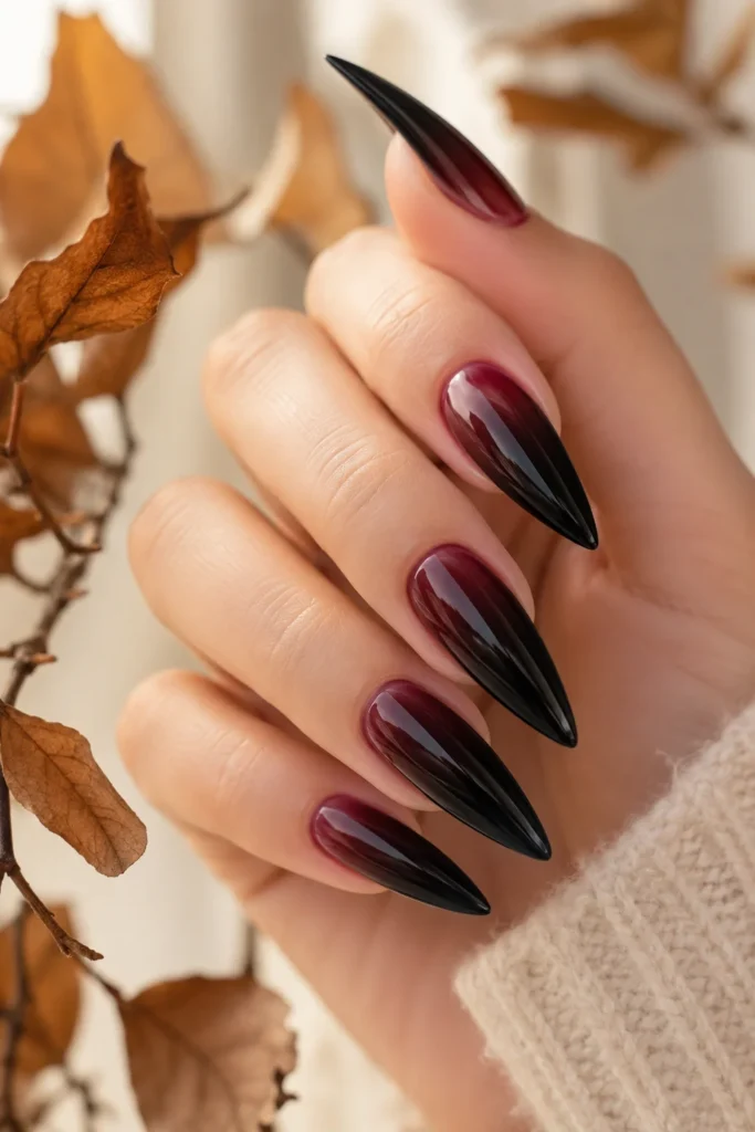 Black and burgundy ombre stiletto nails with smooth blend
