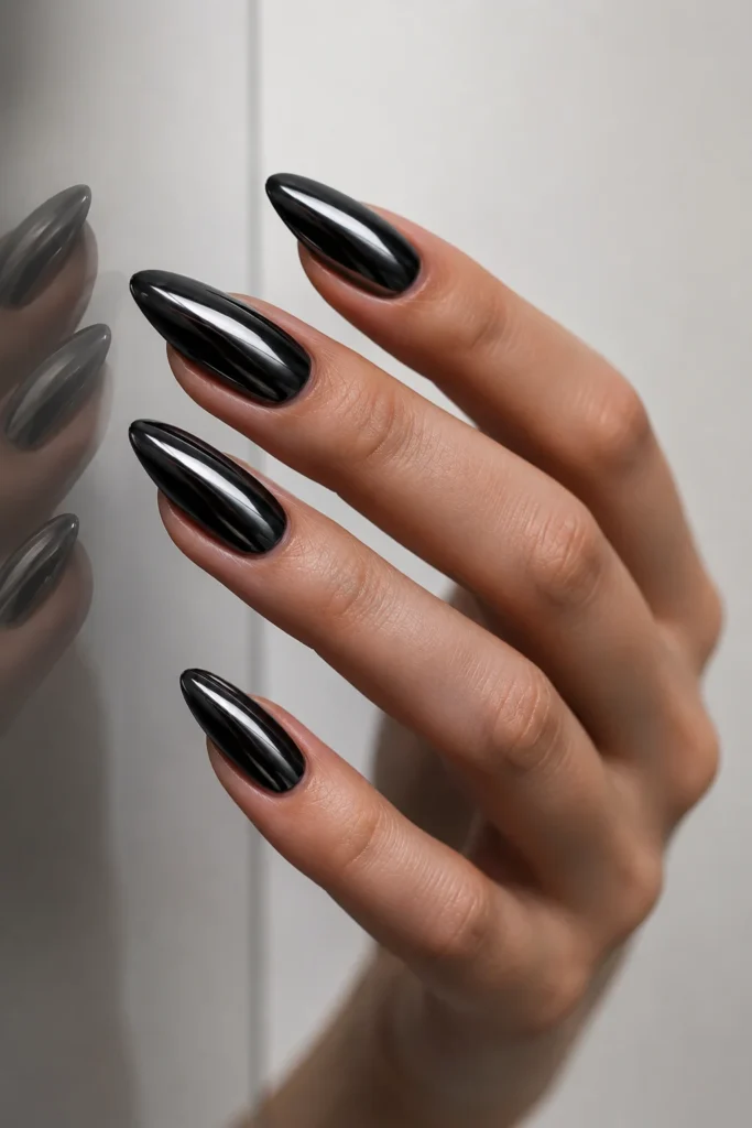 Black chrome mirror Halloween nails with a reflective metallic finish