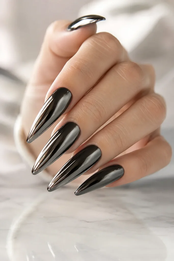 Black chrome stiletto nails with reflective metallic shine