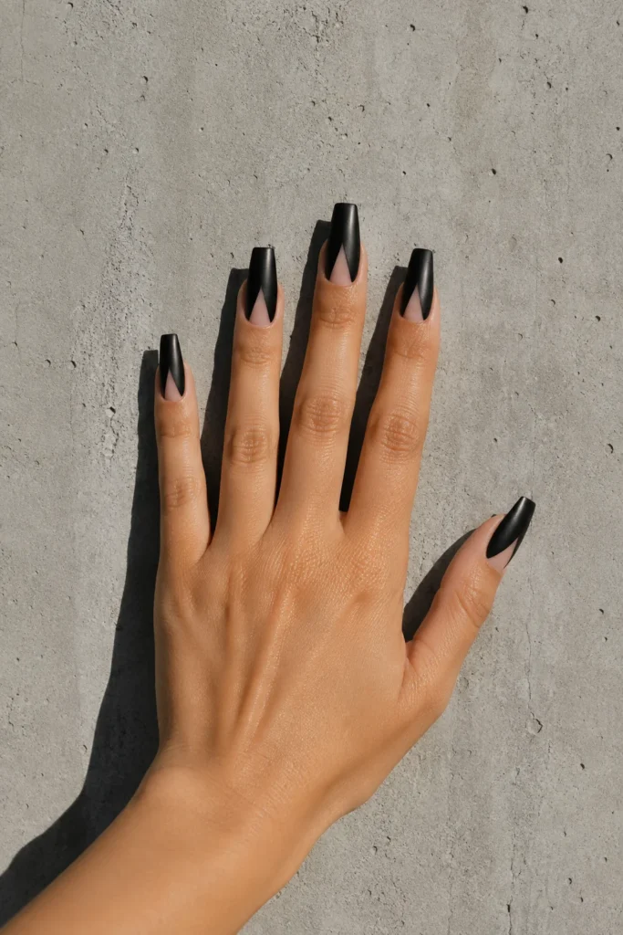 Black coffin nails featuring geometric negative space design