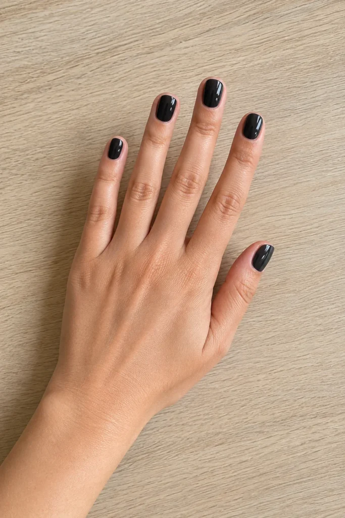 Black glazed donut nails with pearly glossy finish