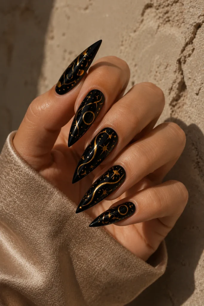 Black nails with abstract gold lines and dots