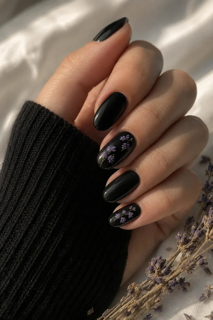 Purple and Black Nail Ideas with delicate purple flowers on black
