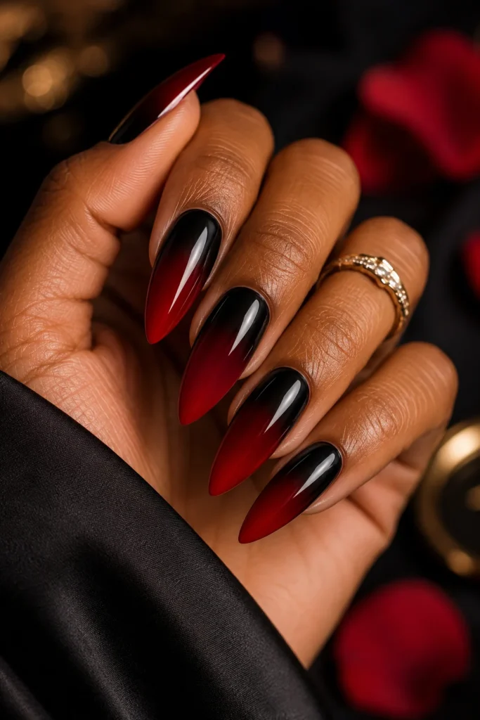Black to red ombre stiletto nails with dramatic glossy vampy gradient