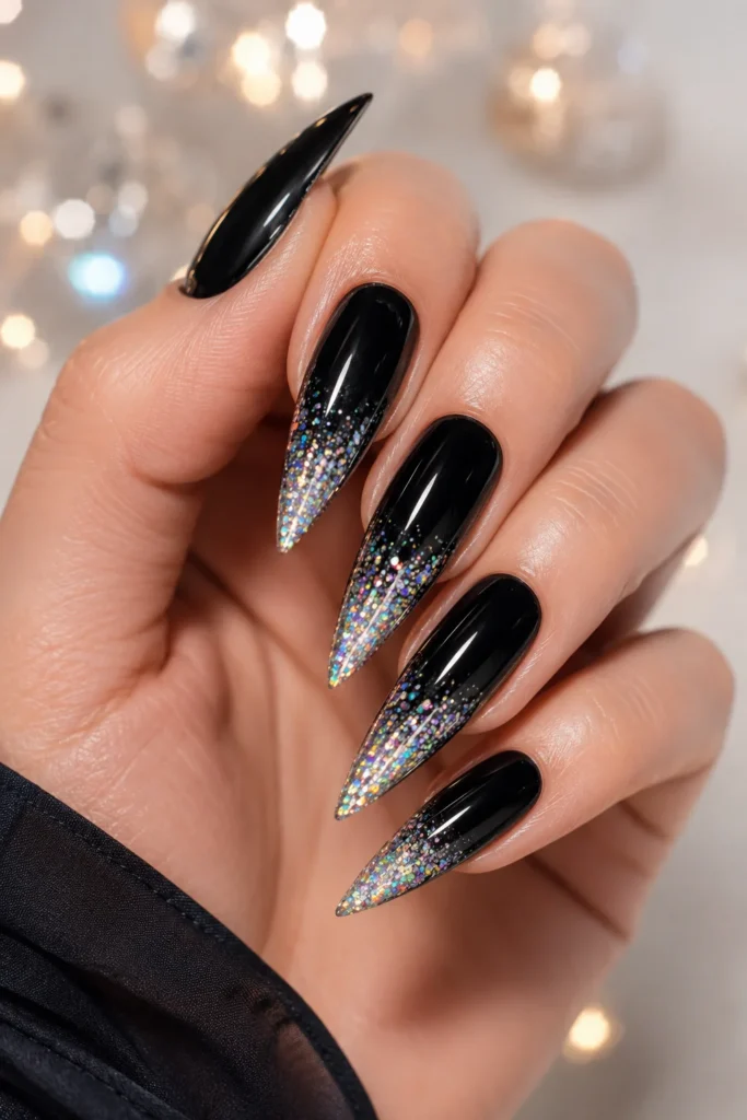 Black stiletto nails with holographic glitter tips
