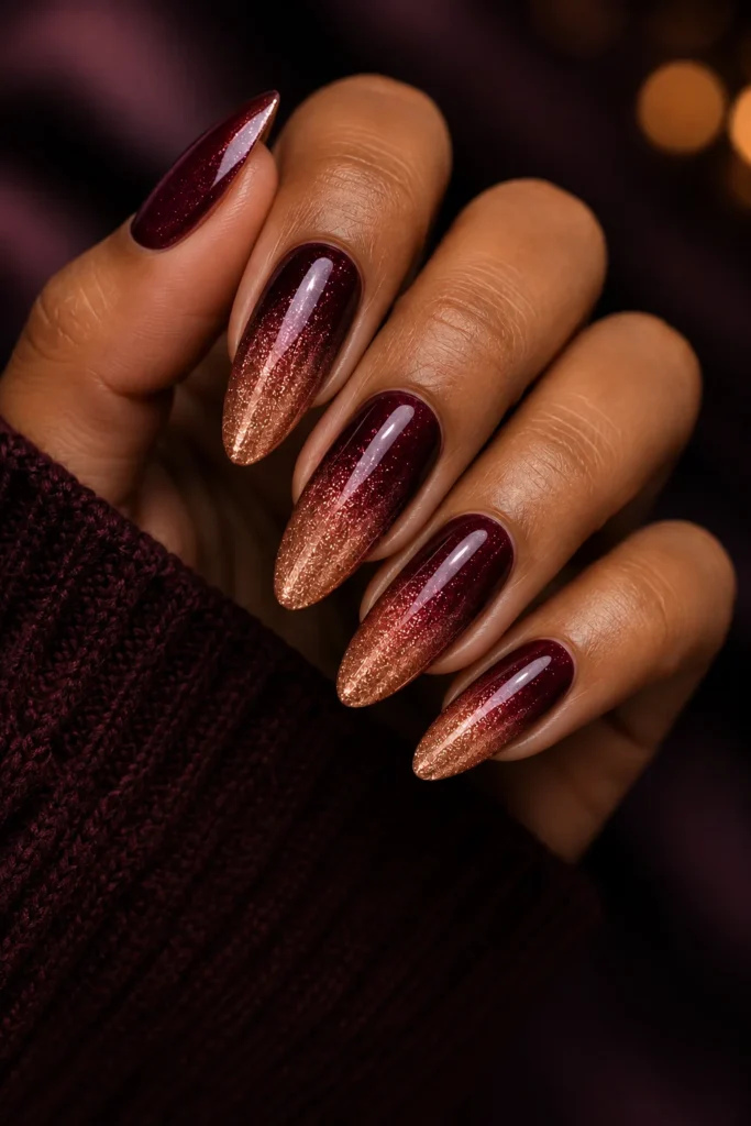 Burgundy to rose gold glitter ombre almond nails with shimmery sparkle