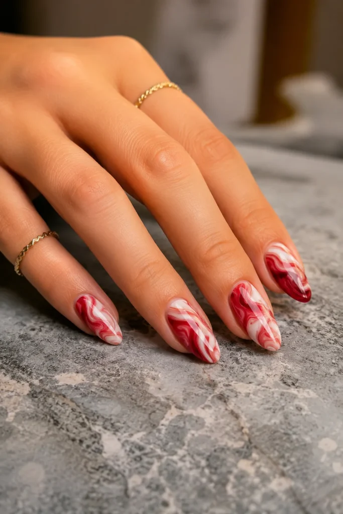 Cherry red and white marble swirl accent nails