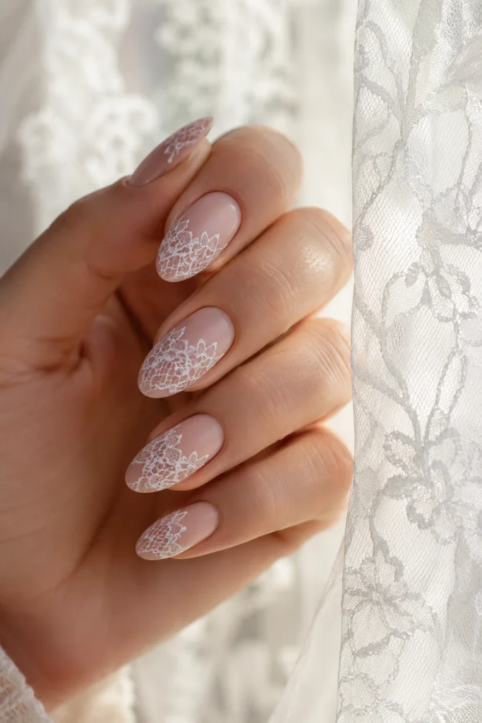 Delicate lace overlay nails with nude pink base