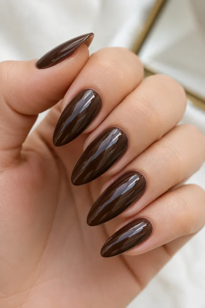 Espresso brown glazed almond nails with soft shine