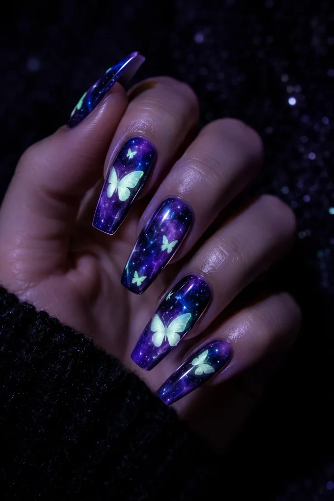 Galaxy purple nails with glowing butterfly designs