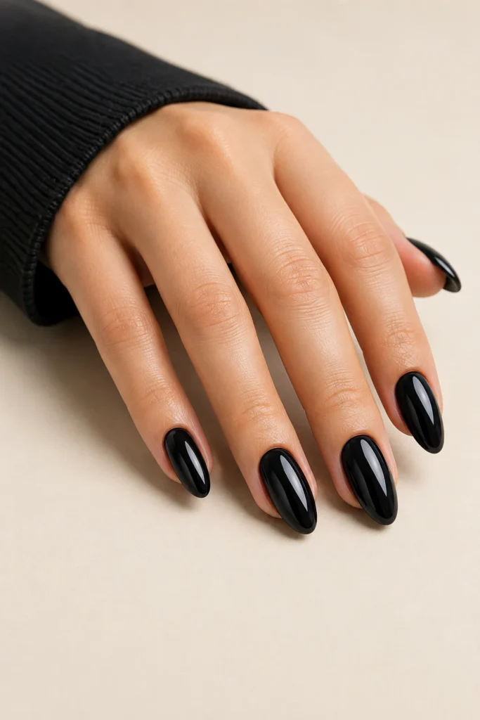 Glossy glazed black wedding nails with a glass-like shine