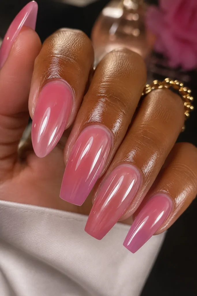 Glazed pink nails with high shine glossy wet-look finish on coffin nails